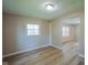 Bright living room with wood floors and a window that provides ample natural light at 1509 E Centennial Ave, Muncie, IN 47303