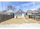 The backyard features a newly-constructed deck, and is surrounded by a privacy fence at 1521 Lawton Ave, Indianapolis, IN 46203