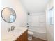 Bathroom with updated vanity and shower combo at 1521 Lawton Ave, Indianapolis, IN 46203