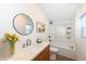 Modern bathroom with stylish sink, mirror, and bathtub at 1521 Lawton Ave, Indianapolis, IN 46203
