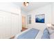 Bright bedroom with light colored bed and an adjacent closet at 1521 Lawton Ave, Indianapolis, IN 46203