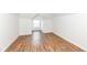 The bedroom is a bright space with updated floors and neutral walls at 1521 Lawton Ave, Indianapolis, IN 46203