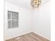 Bright bedroom features a window and modern ceiling light fixture at 1521 Lawton Ave, Indianapolis, IN 46203