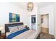 Stylish bedroom featuring a comfortable bed, closet, and modern lighting fixture at 1521 Lawton Ave, Indianapolis, IN 46203