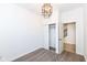 Bedroom features an open closet and neutral flooring at 1521 Lawton Ave, Indianapolis, IN 46203