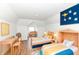 Bright bedroom with two beds, a desk, and wooden floors offering a cozy and stylish space at 1521 Lawton Ave, Indianapolis, IN 46203