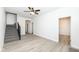 Open-concept living area featuring modern floors, fresh paint, stairs to the second level, and ample natural light at 1521 Lawton Ave, Indianapolis, IN 46203