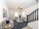 Bright living room featuring modern furniture, wood floors, and a decorative ceiling fan at 1521 Lawton Ave, Indianapolis, IN 46203