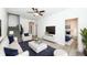 Inviting living room with modern furniture, stairs, and plenty of natural light at 1521 Lawton Ave, Indianapolis, IN 46203