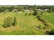 Expansive aerial view showcasing a large lot, mature trees, and a serene setting at 15415 E 146Th St, Noblesville, IN 46060
