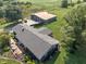 Expansive property featuring a cozy home with a front porch, complemented by mature trees at 15415 E 146Th St, Noblesville, IN 46060