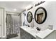 Modern bathroom with double vanity, subway tile, wood accents and shower at 15415 E 146Th St, Noblesville, IN 46060