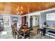 Comfortable dining room with wood ceiling and floors, plus view to kitchen at 15415 E 146Th St, Noblesville, IN 46060