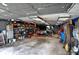 Organized garage with shelving units, ample lighting, tools, and space to work on a car at 15415 E 146Th St, Noblesville, IN 46060