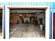 Bright and spacious garage with ample storage space and a view to the exterior at 15415 E 146Th St, Noblesville, IN 46060