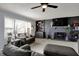 Comfortable living room showcases a fireplace with shelving and natural light at 15415 E 146Th St, Noblesville, IN 46060