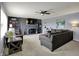Inviting living room with fireplace, built-in bookshelves, and comfortable seating at 15415 E 146Th St, Noblesville, IN 46060