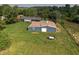 An outbuilding on a large green lot provides ample storage space at 15415 E 146Th St, Noblesville, IN 46060
