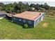 A spacious outbuilding with ample windows sits on a well-maintained lawn at 15415 E 146Th St, Noblesville, IN 46060