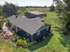 Aerial view featuring a charming home, deck, and large outbuilding at 15415 E 146Th St, Noblesville, IN 46060