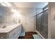 Well-lit bathroom features double sinks, modern fixtures, and a separate shower at 16164 Loire Valley Dr, Fishers, IN 46037