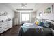 Cozy bedroom features a tray ceiling, natural light, and hardwood floors at 16164 Loire Valley Dr, Fishers, IN 46037