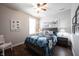 Cozy bedroom features a ceiling fan and a large window for ample natural light at 16164 Loire Valley Dr, Fishers, IN 46037