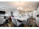 Open concept dining area with stylish chairs, a marble table, and easy access to the kitchen at 16164 Loire Valley Dr, Fishers, IN 46037