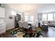 Inviting dining area features stylish chairs, a contemporary table, and a colorful rug at 16164 Loire Valley Dr, Fishers, IN 46037