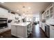 Gourmet kitchen featuring white cabinets, a large island, stainless appliances and hardwood floors at 16164 Loire Valley Dr, Fishers, IN 46037