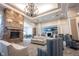 Grand lobby features a stone fireplace, elegant chandelier, and comfortable seating at 16164 Loire Valley Dr, Fishers, IN 46037