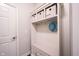 Inviting mudroom features a built-in bench with storage and decorative wall hooks at 16164 Loire Valley Dr, Fishers, IN 46037
