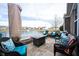 Inviting stone patio with comfortable seating, perfect for enjoying the beautiful pond and neighborhood views at 16164 Loire Valley Dr, Fishers, IN 46037