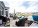 Relaxing outdoor patio space with stylish furniture and views of the tranquil pond, ideal for entertaining at 16164 Loire Valley Dr, Fishers, IN 46037