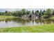 Beautiful pond with a scenic waterfall feature, enhancing the natural beauty of the landscape at 16164 Loire Valley Dr, Fishers, IN 46037