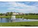Scenic pond with a fountain, surrounded by lush greenery at 16164 Loire Valley Dr, Fishers, IN 46037