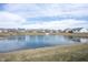 Scenic view of a community pond with a central fountain, showcasing the neighborhood's tranquil ambiance at 16164 Loire Valley Dr, Fishers, IN 46037