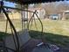 Backyard featuring a porch swing and a shed in a grassy area with room to relax at 224 Griffin Rd, Indianapolis, IN 46227