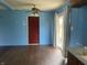 Open dining area with dark wood flooring, and access to the backyard at 224 Griffin Rd, Indianapolis, IN 46227