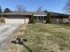 Exterior shot of the ranch style house on a sunny day with an attached garage at 224 Griffin Rd, Indianapolis, IN 46227