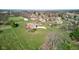 An aerial view of a beautiful home, in-ground pool, and detached garage on expansive manicured lawn at 2274 W Huntsville Rd, Pendleton, IN 46064