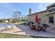 Brick home featuring a covered pool, patio with seating, and expansive yard for outdoor living and recreation at 2274 W Huntsville Rd, Pendleton, IN 46064