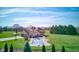 Aerial view of a sprawling backyard with a covered pool, mature trees, and well-manicured lawn at 2274 W Huntsville Rd, Pendleton, IN 46064