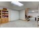 Open basement space offers versatile potential, including a closet, shelving and stair access to other floors at 2274 W Huntsville Rd, Pendleton, IN 46064