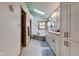 Bright bathroom featuring a walk-in closet, skylight, and double vanity with ample storage at 2274 W Huntsville Rd, Pendleton, IN 46064