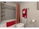 Bathroom featuring a shower-tub combo with a tile backsplash and neutral walls at 2274 W Huntsville Rd, Pendleton, IN 46064