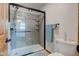 Modern bathroom featuring a glass shower enclosure, gray tiles, and neutral-toned walls at 2274 W Huntsville Rd, Pendleton, IN 46064