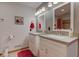 Bathroom with double sinks, white cabinetry, and bright lighting for a modern feel at 2274 W Huntsville Rd, Pendleton, IN 46064