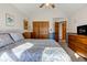 Cozy bedroom with hardwood accents, vaulted ceiling, and neutral walls at 2274 W Huntsville Rd, Pendleton, IN 46064