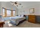 Relaxing bedroom with blue accents, a ceiling fan, and natural light from the bay windows at 2274 W Huntsville Rd, Pendleton, IN 46064